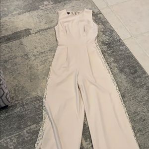 Cream romper by Bebe